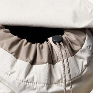 Bellroy cinch minipack backpack interior in oat, cinch opening and elastic pocket detail