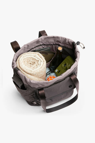 Bellroy cinch tote bag interior view with rolled towel and small items