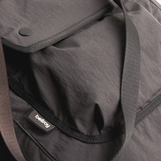 Bellroy cinch tote interior close-up with Bellroy label and dark webbing trim