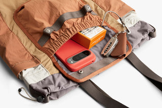 Tan cinch tote interior with smartphone sleeve and key clip attachment