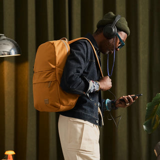 Bellroy Classic Daypack in tan and black, front pocket and top handle