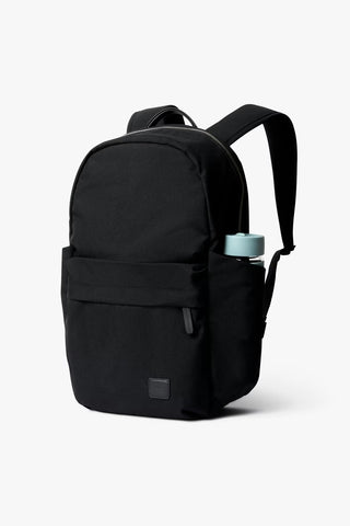 Black daypack backpack with curved top carry handle and two shoulder straps