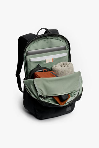 Olive green backpack open with clear divider, mesh pocket, and inner organizers