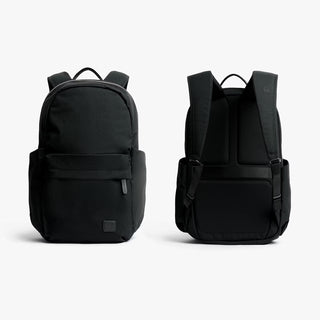 Black daypack front and back views with zip pocket and padded shoulder straps