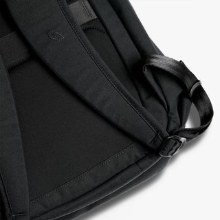 Black padded shoulder strap with adjustable buckle and stitched panel detail