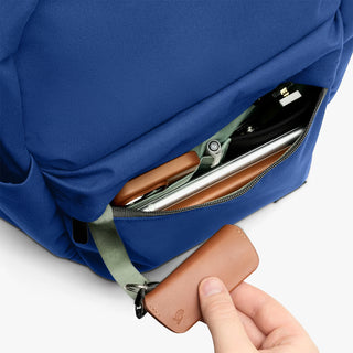 Bellroy Classic Daypack close-up: indigo fabric zip pocket with tan leather pull tab