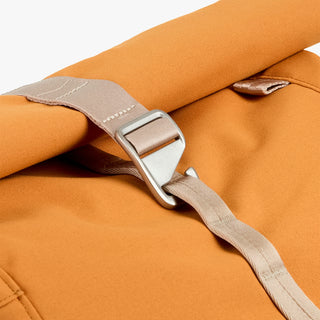 Butterscotch roll-top backpack cinch strap with silver metal buckle
