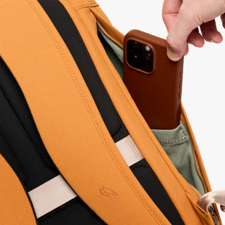 Butterscotch backpack shoulder strap with leather phone holder and embossed logo