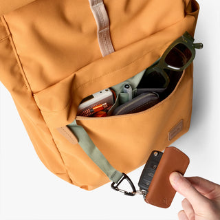 Butterscotch backpack front pocket with accessories and small leather key holder