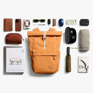 Butterscotch roll-top backpack front view with logo patch and roll-top closure