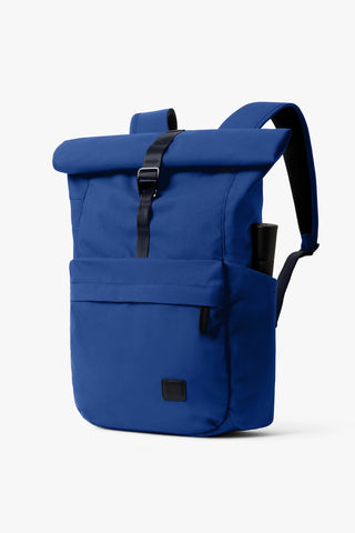 Bellroy indigo rolltop backpack with black roll strap and side pocket