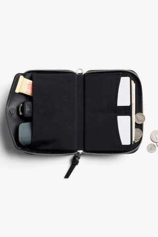 Black zip-around folio wallet open with card slots and coin compartment