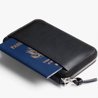 Black folio wallet zip-open with blue passport sleeve and card slots