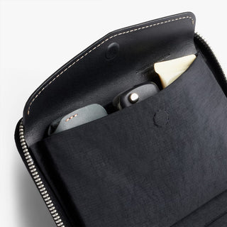 Black leather folio wallet interior with card pockets and small accessory slots