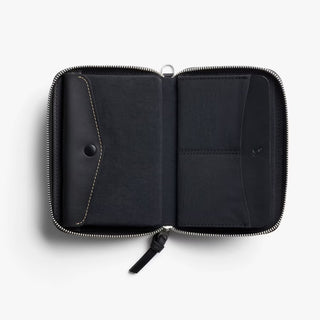 Black zip-around folio wallet open with card pockets and stitched divider