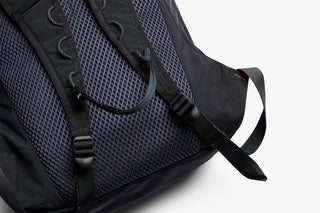 Black daypack back panel with breathable mesh and padded shoulder straps