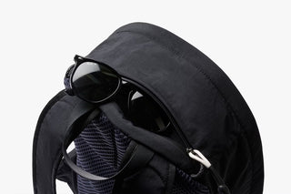 Black daypack top with smooth zipper and compact curved shoulder straps