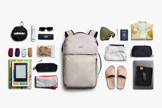 Light gray backpack with open main compartment and padded back panel