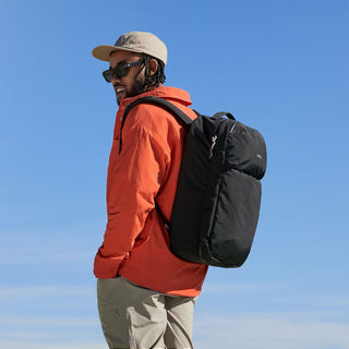 Bellroy Lite Travel Pack 30L Ash backpack, worn on back with padded shoulder straps