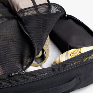 Black bellroy backpack open interior with mesh pocket and zip divider