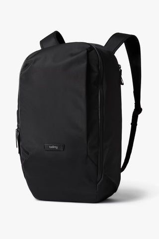 Black work backpack with top handle, zip front pocket, and dual shoulder straps