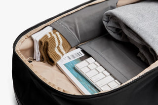 Black backpack interior with document pockets and zipped organizer area