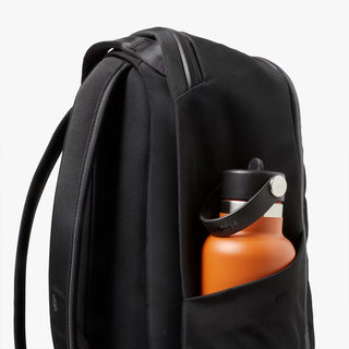 Black backpack front-right view with side water bottle pocket and top carry handle