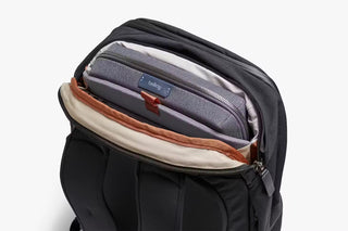 Bellroy work backpack front pocket showing gray lining and orange zipper pull
