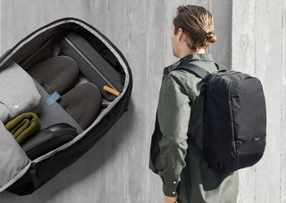 Midnight black work backpack open view with internal mesh pockets and zip compartments