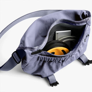 Lilac mini messenger bag open with ruched top and zipper access
