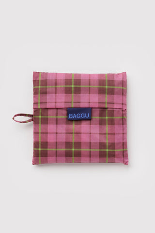 Big BAGGU folded bag pouch in pink tartan plaid with BAGGU tag and wrist strap