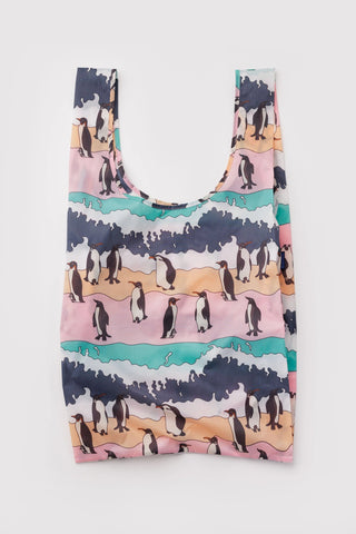 Large BAGGU reusable tote bag with penguin pattern in pink, teal, and dark navy