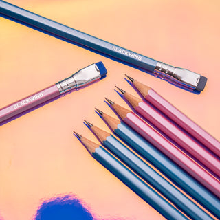 Assorted sharpened pencils in pink and blue, with erasers and wood tips