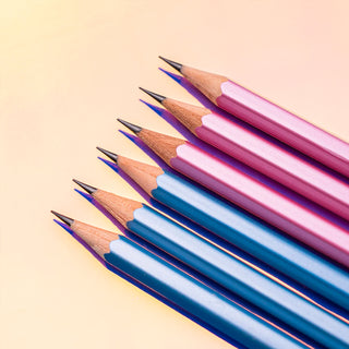 Set of sharpened pencils in pink and blue with wood tips