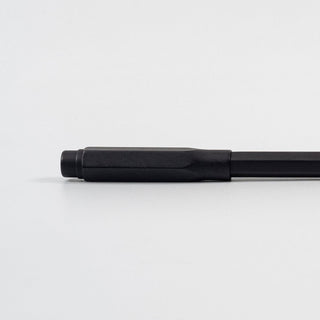 Matte black pencil point guard, cylindrical with textured grip