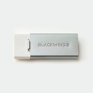 Blackwing metal-toned holder with white eraser block, close-up