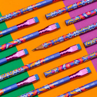 Decorative pencils with patterned blue barrels and pink metal ferrules in neat rows