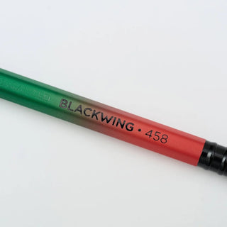 Blackwing 458 pencil with green-to-red barrel and black tip, printed BLACKWING 458