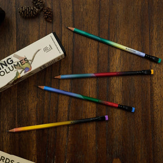 Blackwing Volume 458 colored pencils laid on wood with product box nearby