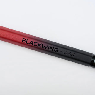 Blackwing Volume 458 pencil close-up showing barrel text and black tip
