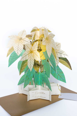 Pop-up Christmas card with layered green and gold poinsettia leaves