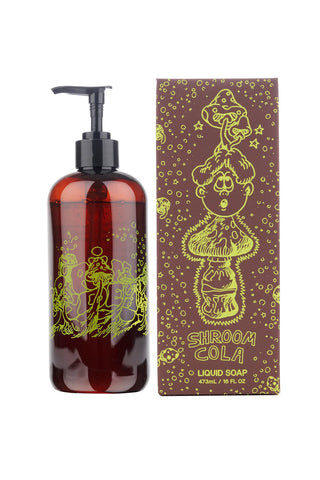 Amber liquid castile soap bottle with black pump and illustrated Shroom Cola box