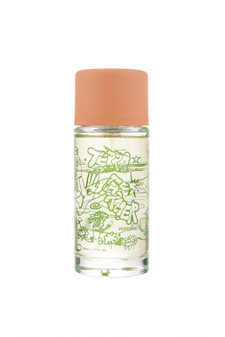 Clear glass perfume bottle with orange cap and green label artwork