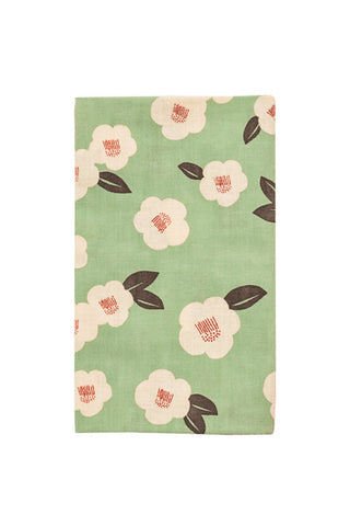 Camellia tenugui towel in mint green with pale pink flowers and dark leaves