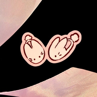 Candy Apple Comics bunny slipper sticker with two cartoon slippers, pink outline