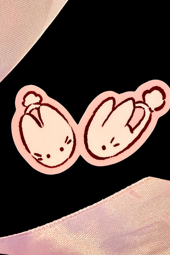 Candy Apple Comics bunny slipper sticker with two cartoon slippers, pink outline