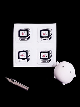 Desktop bubble sticker sheet with four cartoon computer cat icons in squares