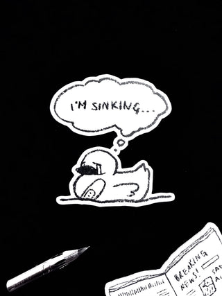 Vinyl sticker with cartoon character lying down and speech bubble reading “I'm Sinking...”