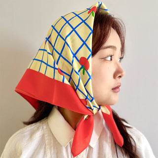Centinelle bandana head scarf in profile, blue grid cream with red apples and cat face