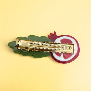 Gold-tone metal alligator clip with pomegranate ring and green leaf design